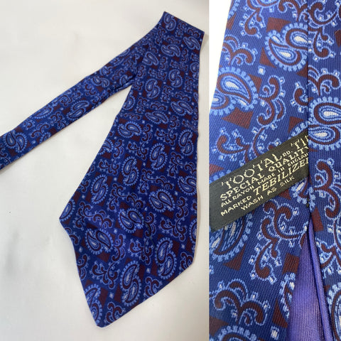 Tootal tie special quality label in blue and red paisley. Lined with open backs and short blade at 125cm long 9cm wide. No damage.