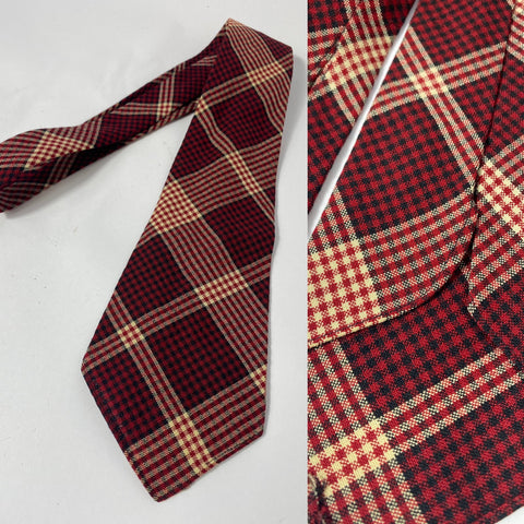 1940s tie British made in red white and black plaid pattern. No lining with open backs and short blade at 119cm long and 9cm wide.