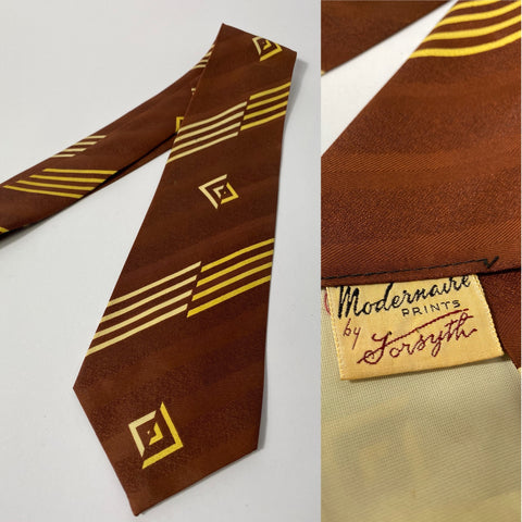 1940s US swing tie in chocolate brown stripes with cream and yellow  abstract stripes. Open backs and short blade at 125cm long 8cm wide. No damage.