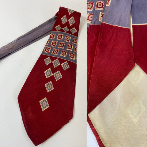 1940s/50s US Swing tie in red with blue and cream motif pattern. Lined with open backs and fairly short blade at 130cm long 11cm wide. Tiny hole on thinner end and not visible when worn.