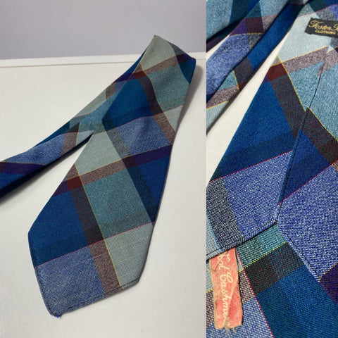1940s British made tie foster Brothers, wool & cashmere. Teal, blue and red plaid. No lining, open backs and short blade at 120cm long 9 cm wide. No damage