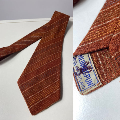 1940s tie Munrospun wool in rust brown stripes. No lining and open backs with short blade at 120cm long and 9cm wide. No damage