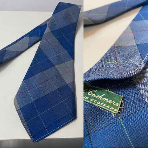 1940s tie wool and cashmere made in Scotland. Blue plaid. No lining and open backs with short blade at 119cm long and 10cm wide. No damage.