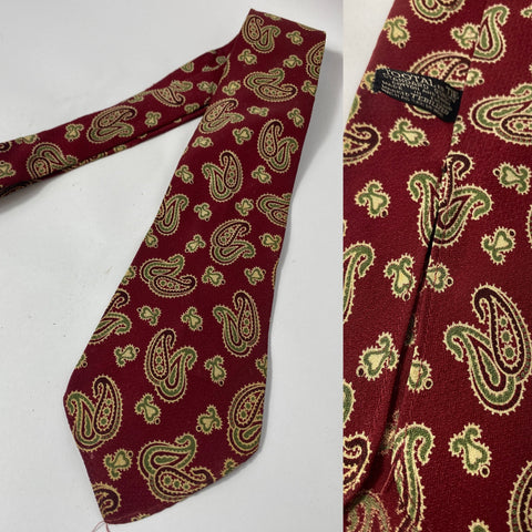 1940s Tootal tie standard quality label in red with cream and green paisley. No lining with open backs and short blade at 120cm long and 9cm wide. Good condition just a tiny hole at front where tie pin would go.