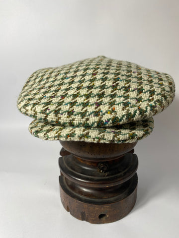 Wide three darted one piece cap hand made reproduction bench made here. Cut from vintage tweed thick wool coating in cream with green and brown large hound tooth pattern. Size 59cm.