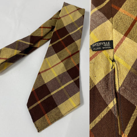 1940s Grenville tie pure wool in yellow, brown and rust red plaid pattern. No lining with open backs and short blade at 120cm long and 10cm wide. No damage except a tiny hole on thinner end tip.