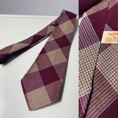 1940s tie,klipper wool, made in England in maroon fawn and red plaid box check. No lining, open backs and short blade at 120cm long 10cm wide. No damage.