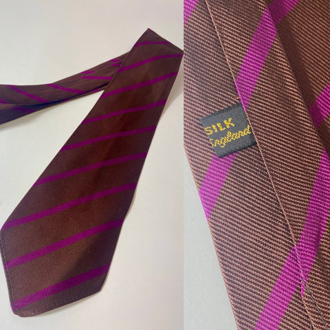 1940s/50s silk tie made in England. Chocolate brown with purple stripe, no lining, open backs and short blade at 125cm long 10cm wide. No damage.