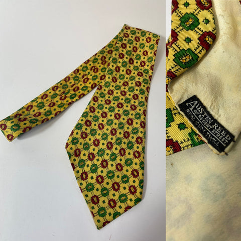 1940s tie Austin Reed in real silk twill. Pastel yellow with green and red geometric repeat pattern. Open backs and short blade at 124cm long and 10cm wide. No damage.