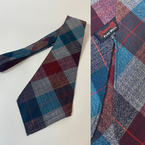 1940s Grenville tie in grey blue and claret plaid pattern. No lining with open backs and short blade at 120cm long and 10cm wide. No damage.