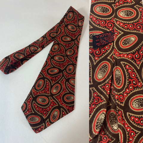 1940s Tootal tie in red quality label. Bold linear pattern in Brown, red and cream. No lining and open backs with short blade at 115cm and 9cm wide. No damage.