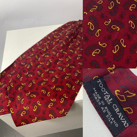 Vintage Tootal cravat in red with yellow and green paisley. Standard cravat Pleated neck line. No damage.