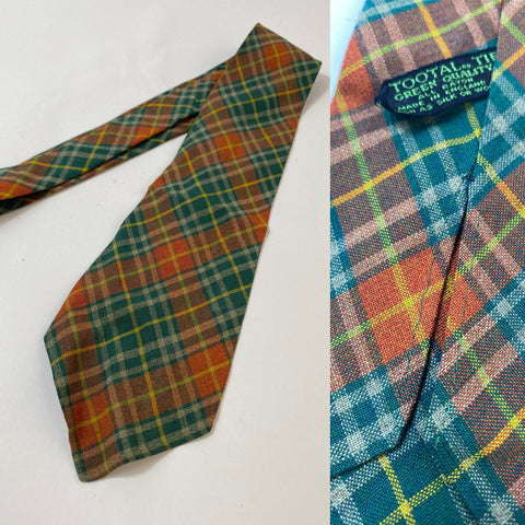 1940s Tootal tie in green quality label bottle green, orange and yellow plaid pattern. No lining and open backs with short blade at 122cm long and 9cm wide. No damage.