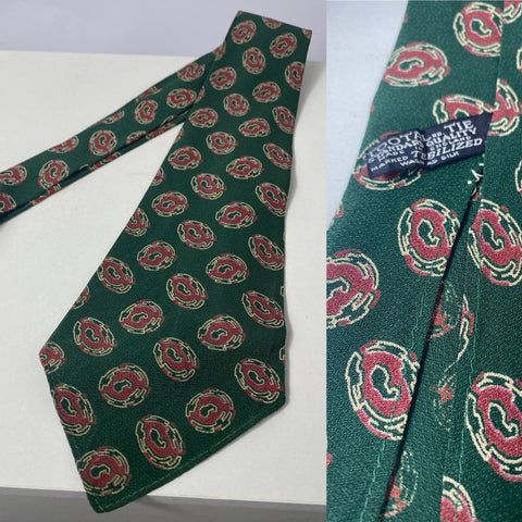 1940s Tootal tie in standard quality label. Bottle green with red and pattern. No lining and open backs with short blade at 127cm long and 10cm wide. No damage.