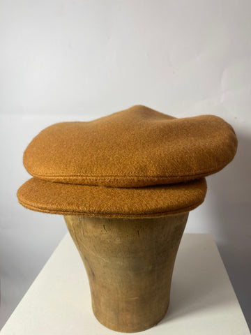 Reproduction 1940s cap wide fit at 11” crown. In a butterscotch with hint of orange felted pure wool. Fully lined in dark brown satin. To fit a size 59cm.
